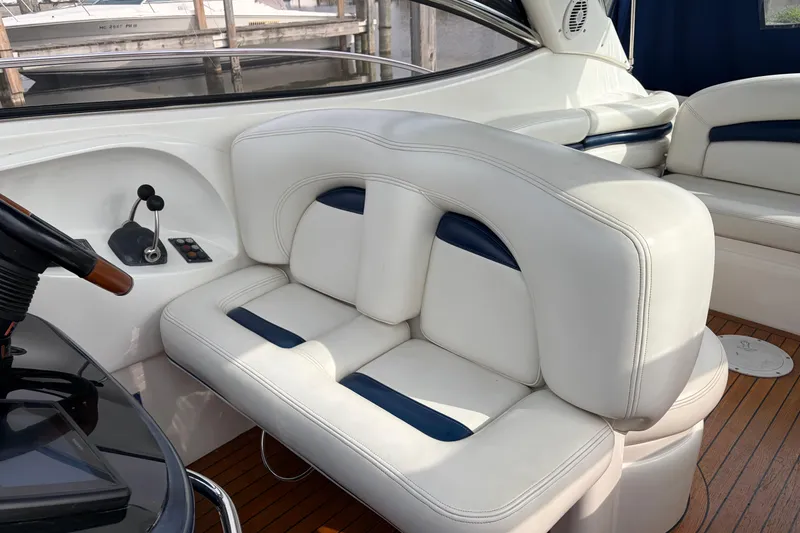 Slide: The Image of Luxurious seating on a 2000 Sunseeker Superhawk 34 yacht with elegant white upholstery. - 20