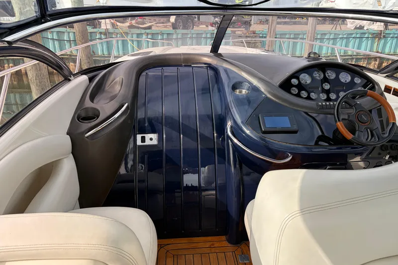 Slide: The Image of Cockpit of 2000 Sunseeker Superhawk 34 with steering wheel and instrument panel. - 23