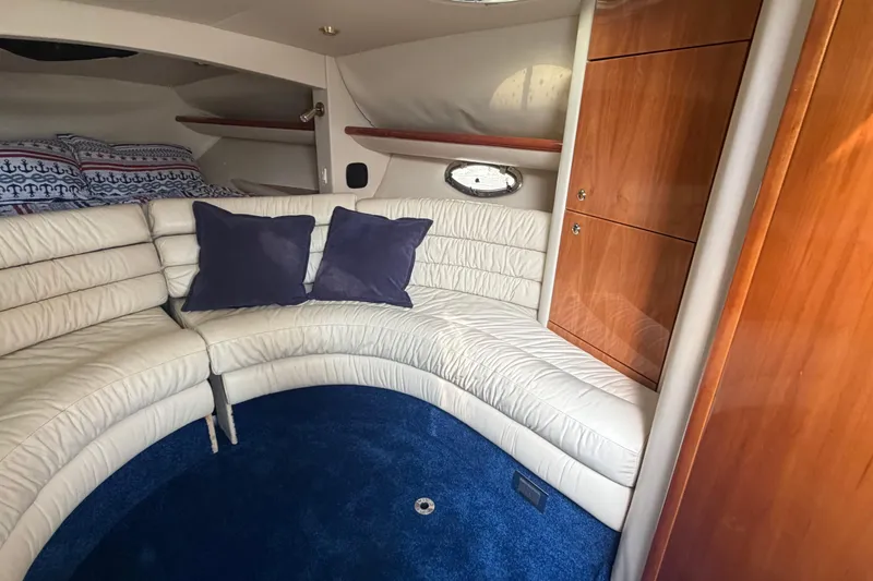 Slide: The Image of Luxurious interior of 2000 Sunseeker Superhawk 34 with plush seating and elegant wood cabinetry. - 29