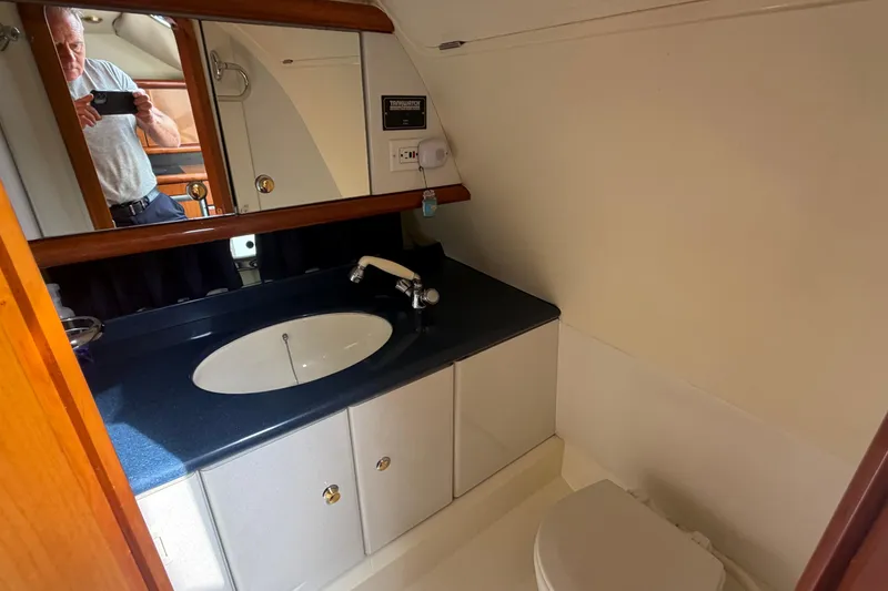 Slide: The Image of Bathroom interior of 2000 Sunseeker Superhawk 34 yacht with sink and mirror. - 31