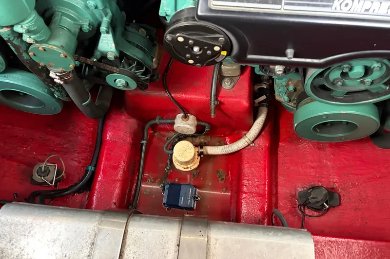 Slide: The Image of Engine compartment of a 2000 Sunseeker Superhawk 34, showcasing mechanical components and wiring. - 35