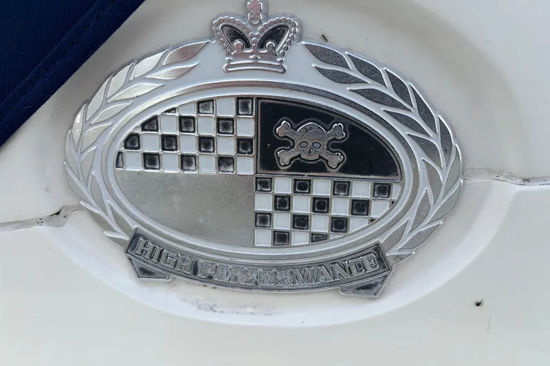 Slide: The Image of Emblem on 2000 Sunseeker Superhawk 34, featuring "High Performance" text and crown design. - 5