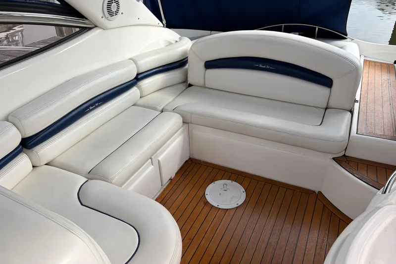 Slide: The Image of Luxurious seating area on a 2000 Sunseeker Superhawk 34 yacht with wooden flooring. - 9