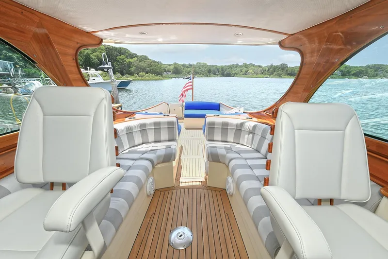 Slide: The Image of Luxurious interior of 2015 Hinckley Talaria 34 yacht with elegant seating and scenic water view. - 13