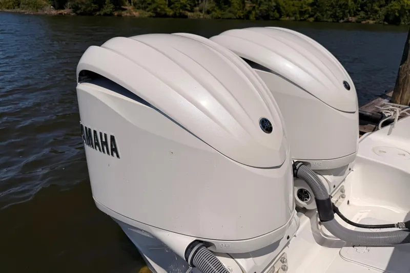 Slide: The Image of Twin Yamaha outboard engines on a 2024 Sea Hunt Gamefish 27 Coffin Box boat. - 12