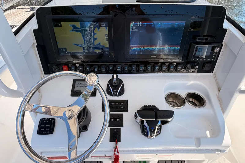 Slide: The Image of 2024 Sea Hunt Gamefish 27 Coffin Box dashboard with navigation screens and controls. - 15
