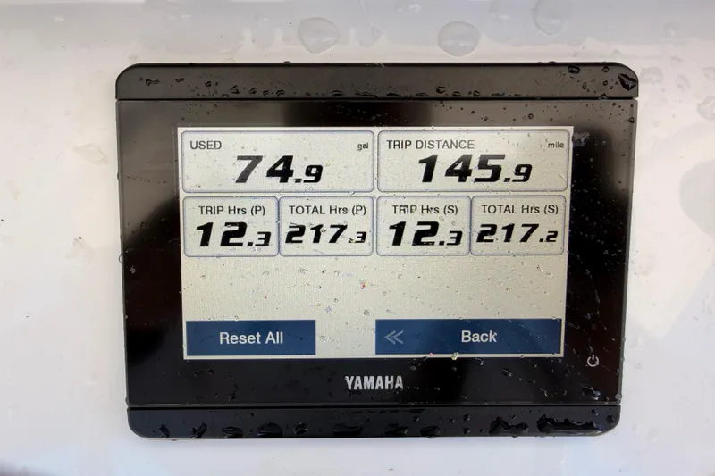 Slide: The Image of Yamaha display showing fuel usage and trip data on 2024 Sea Hunt Gamefish 27 Coffin Box. - 16