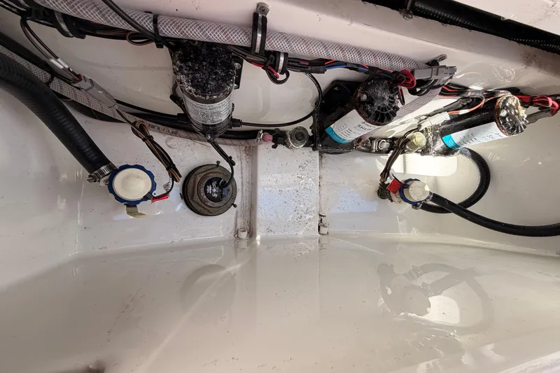 Slide: The Image of 2024 Sea Hunt Gamefish 27 Coffin Box interior wiring and components. - 19