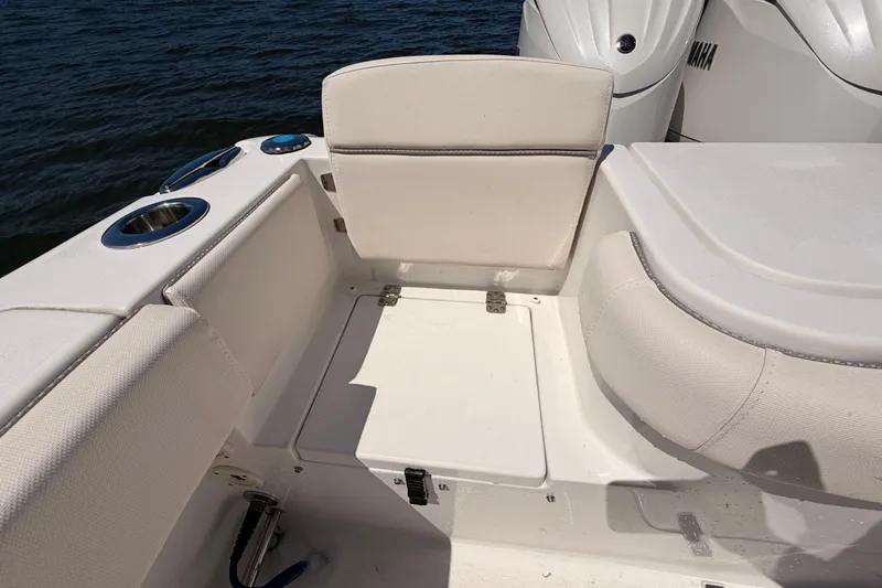 Slide: The Image of 2024 Sea Hunt Gamefish 27 Coffin Box boat interior with seating and cup holders. - 20