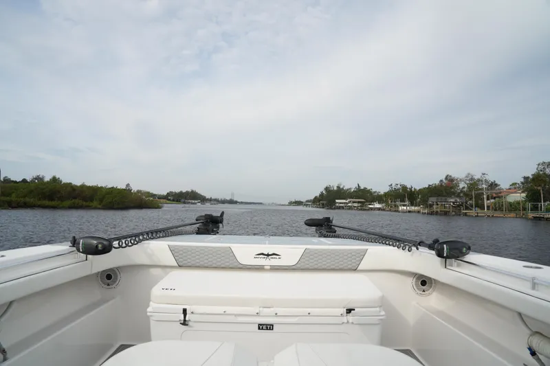 Slide: The Image of 2022 Invincible 46 Catamaran cruising on a calm river. - 11