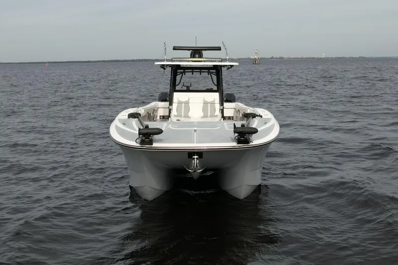 Slide: The Image of 2022 Invincible 46 Catamaran on open water, front view. - 2