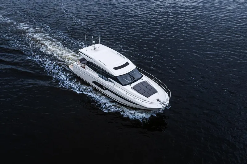 Slide: The Image of Aerial view of 2022 Prestige 520S yacht cruising on open water. - 1