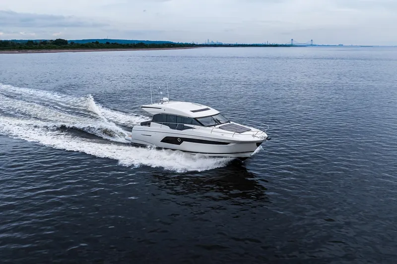 Slide: The Image of 2022 Prestige 520S yacht cruising on open water, showcasing sleek design and performance. - 2