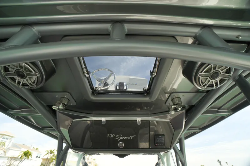 Slide: The Image of 2020 Nor-Tech 390 Sport Center Console interior with speakers and steering wheel view. - 45