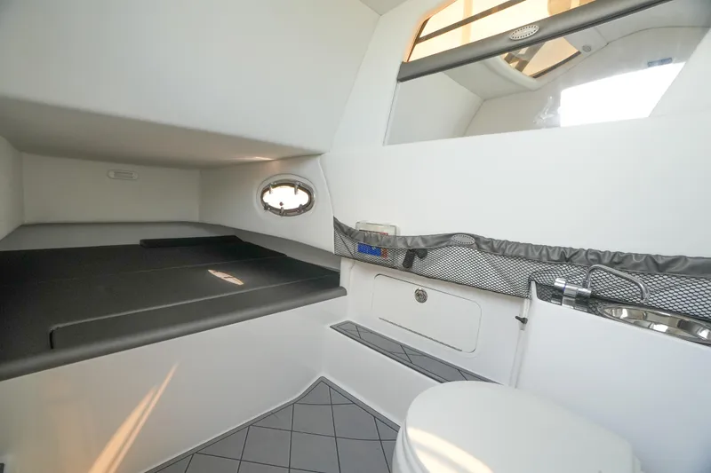 Slide: The Image of 2020 Nor-Tech 390 Sport Center Console cabin interior with bed and toilet. - 49