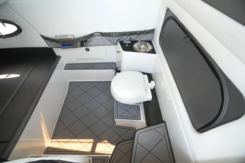 Slide: The Image of 2020 Nor-Tech 390 Sport Center Console bathroom interior with modern design and amenities. - 50