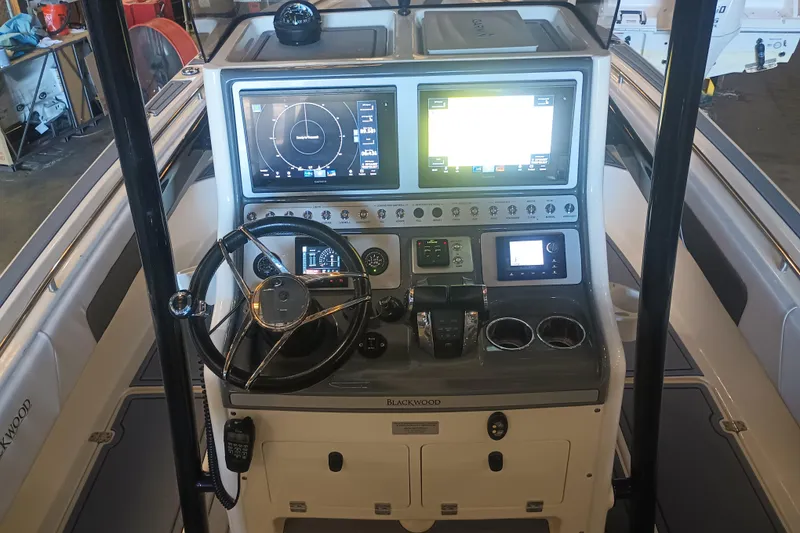 Slide: The Image of 2020 Blackwood 27 boat dashboard with advanced navigation and control systems. - 17
