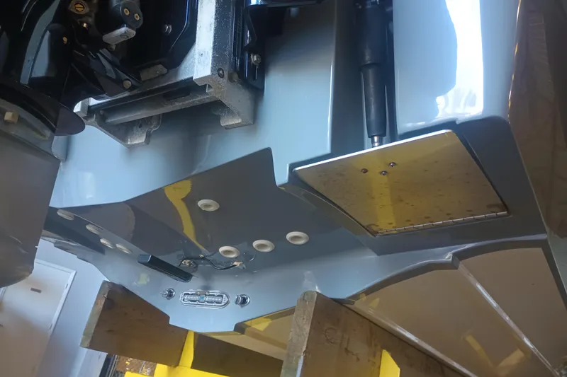 Slide: The Image of Close-up of a 2020 Blackwood 27 boat's underside, showcasing mechanical components and hull details. - 34