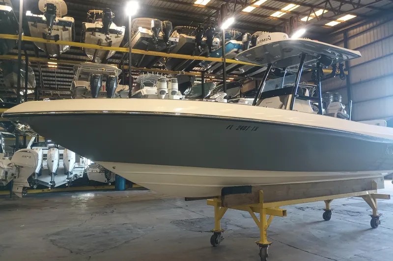 Slide: The Image of 2020 Blackwood 27 boat in storage facility, surrounded by other boats. - 4