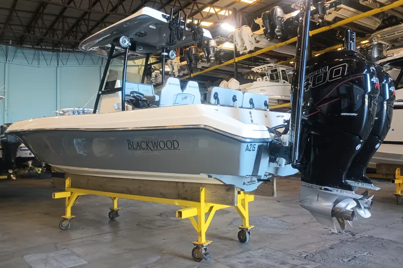 Slide: The Image of 2020 Blackwood 27 boat with dual Mercury 400 engines in a storage facility. - 5