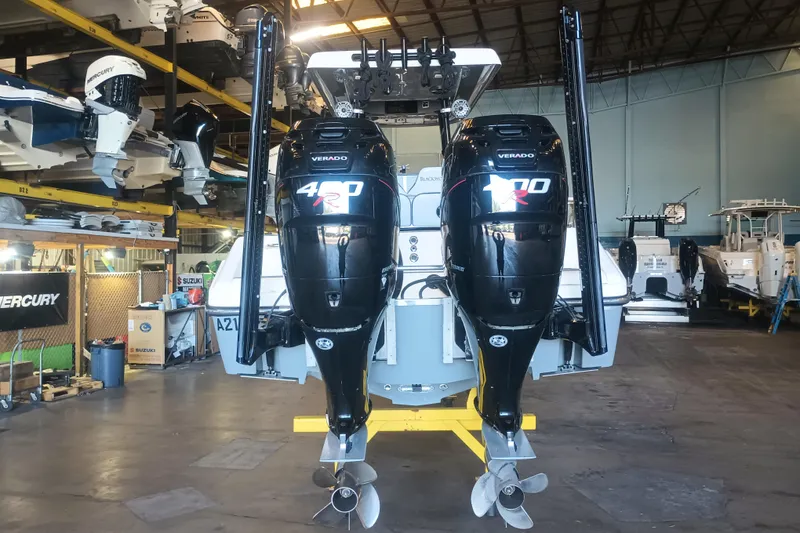 Slide: The Image of 2020 Blackwood 27 boat with dual Mercury Verado 400R engines in a storage facility. - 7