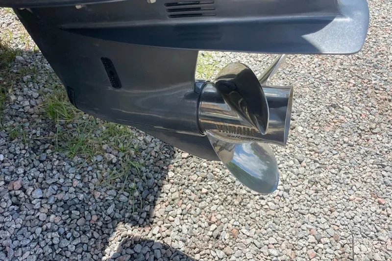 Slide: The Image of Propeller of a 2004 Sea Pro 238 Walk Around boat on gravel surface. - 10