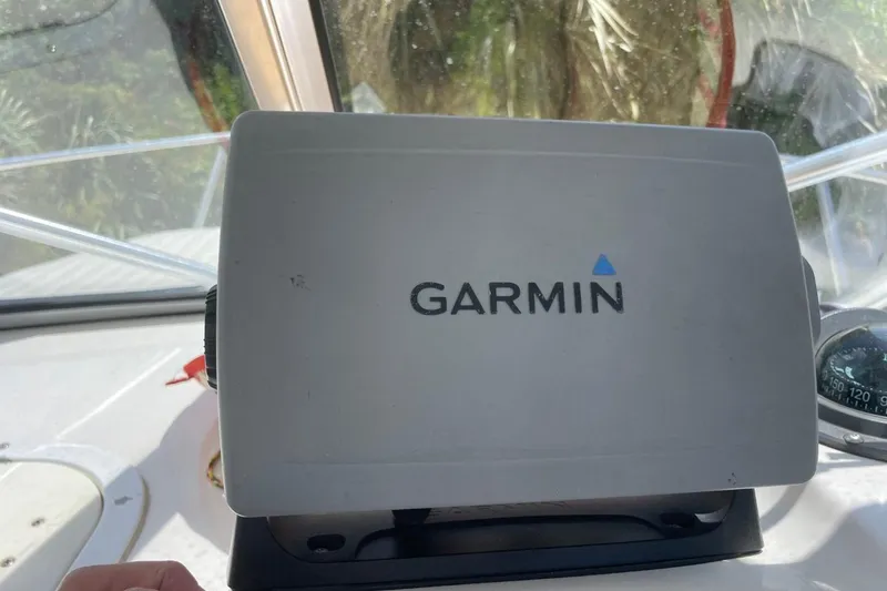 Slide: The Image of Garmin device on 2004 Sea Pro 238 Walk Around boat dashboard. - 14