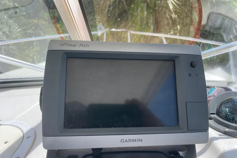 Slide: The Image of Garmin GPSmap 740s on 2004 Sea Pro 238 Walk Around boat dashboard. - 15