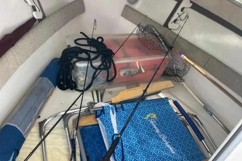 Slide: The Image of Interior of 2004 Sea Pro 238 Walk Around with fishing gear and equipment. - 16