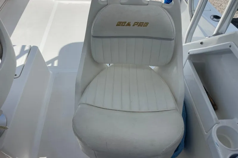 Slide: The Image of White captain's chair on 2004 Sea Pro 238 Walk Around boat. - 18
