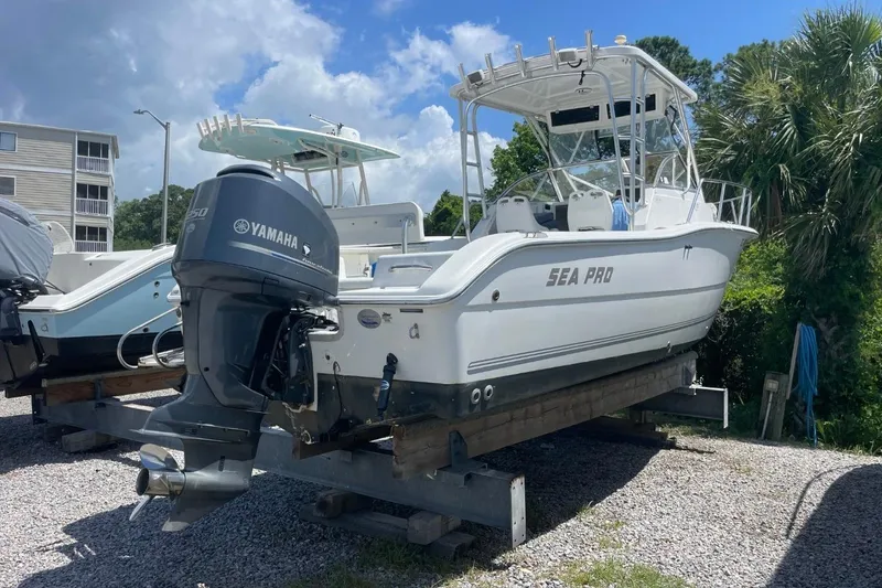 Slide: The Image of 2004 Sea Pro 238 Walk Around boat with Yamaha engine on display outdoors. - 8