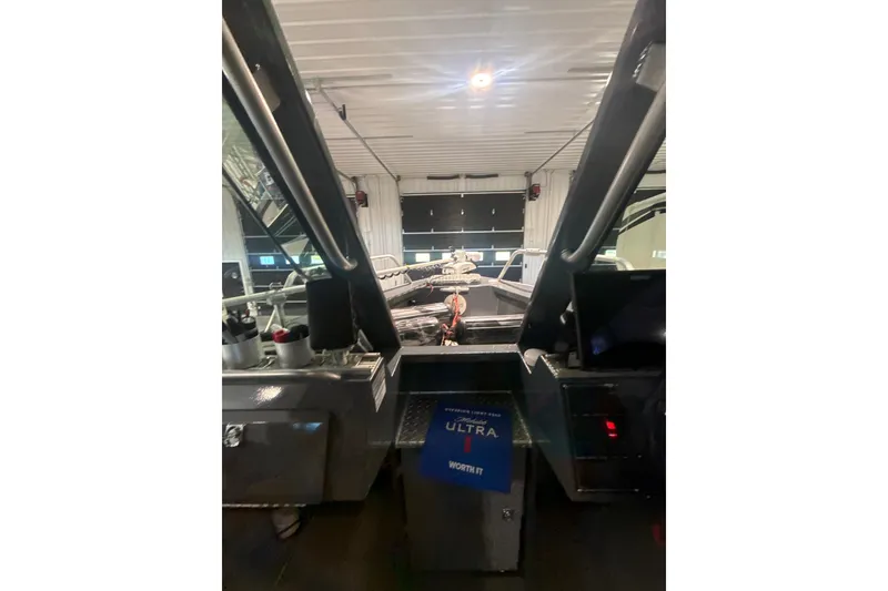 Slide: The Image of Interior view of 2022 Hewescraft 270 Alaskan Hardtop in a garage setting. - 15
