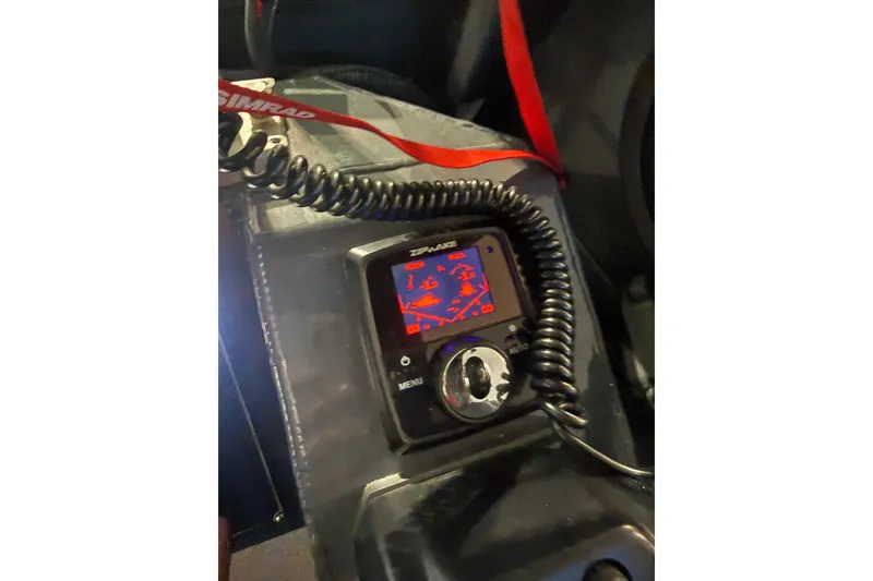 Slide: The Image of Close-up of a Simrad marine device in a 2022 Hewescraft 270 Alaskan Hardtop boat. - 30