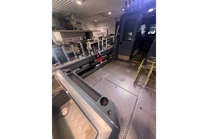 Slide: The Image of Interior of 2022 Hewescraft 270 Alaskan Hardtop, showcasing spacious deck and modern equipment. - 33