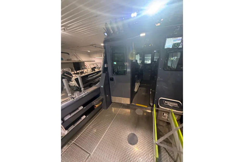 Slide: The Image of 2022 Hewescraft 270 Alaskan Hardtop interior view in a showroom setting. - 36