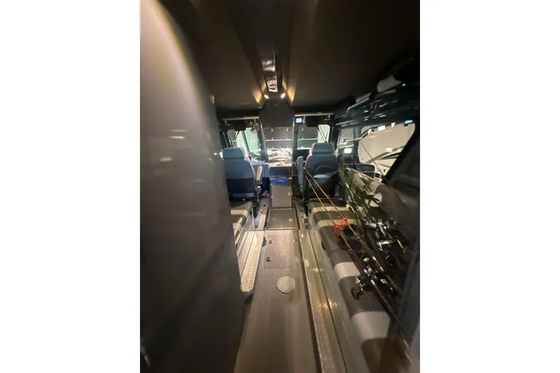 Slide: The Image of Interior view of 2022 Hewescraft 270 Alaskan Hardtop boat, showcasing seating and equipment. - 9