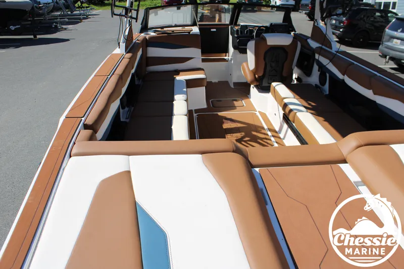 Slide: The Image of Interior view of an Axis A245 boat with brown and white upholstery. - 11