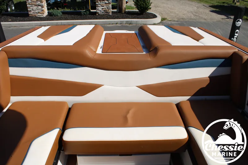 Slide: The Image of Interior view of an Axis A245 boat with brown and white seating. - 15