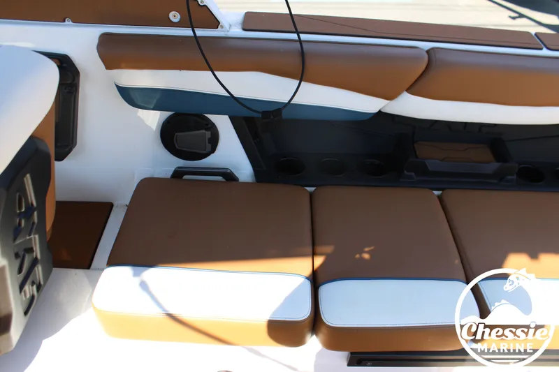 Slide: The Image of Interior of a 2025 Axis A245 boat with brown and white upholstery. - 16