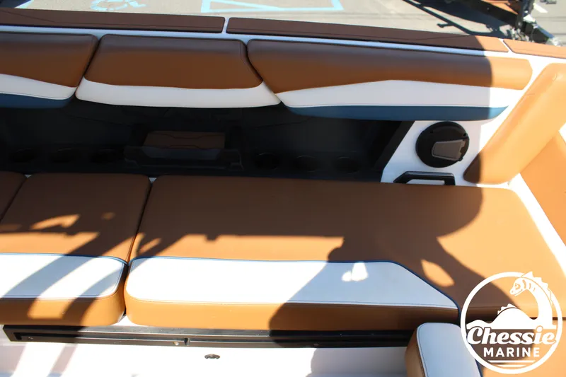 Slide: The Image of Interior of an Axis A245 boat with brown and white seating. - 17