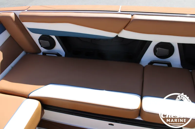Slide: The Image of Interior of a 2025 Axis A245 boat with brown and white upholstery. - 20