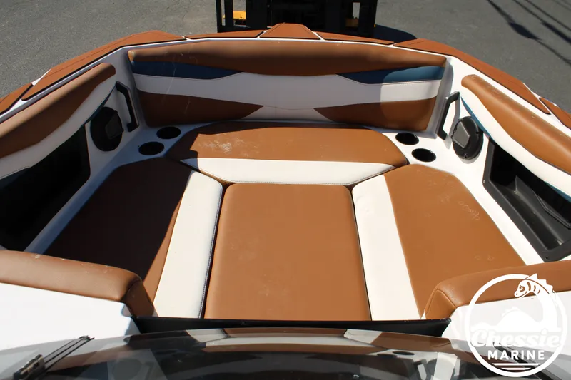 Slide: The Image of Interior view of an Axis A245 boat with brown and white seating. - 25