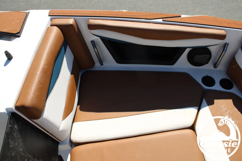 Slide: The Image of Interior view of a 2025 Axis A245 boat with brown and white upholstery. - 26