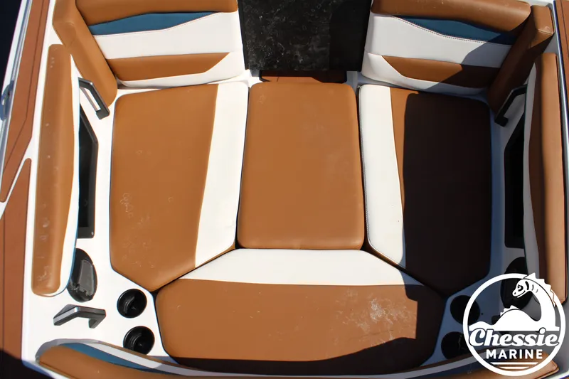 Slide: The Image of Interior of an Axis A245 boat with brown and white upholstery. - 29