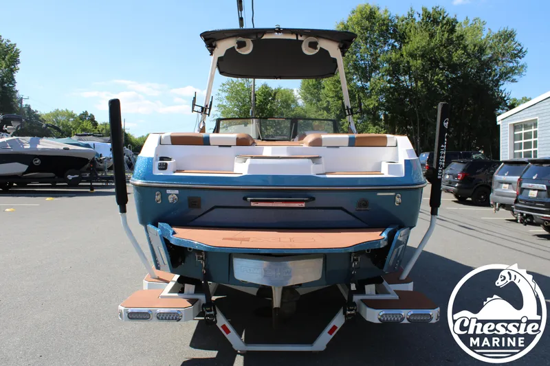 Slide: The Image of The image shows a 2025 Axis A245 boat in a parking lot. - 4