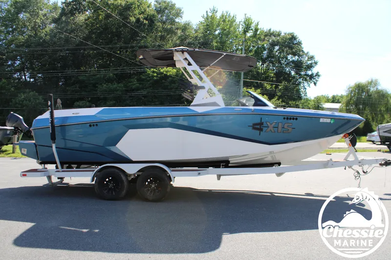 Slide: The Image of An Axis A245 boat from 2025 on a trailer, featuring a blue hull and black sunshade. - 6