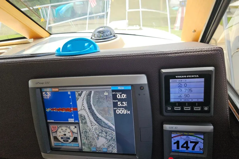 Slide: The Image of Dashboard of a 2013 Cutwater 28 boat with GPS and engine displays. - 21