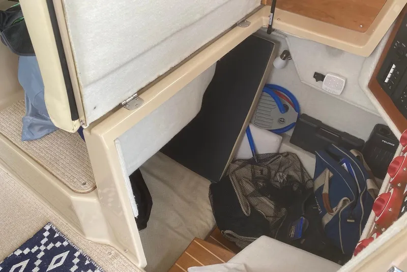 Slide: The Image of Interior storage area of a 2013 Cutwater 28 boat with various equipment. - 29