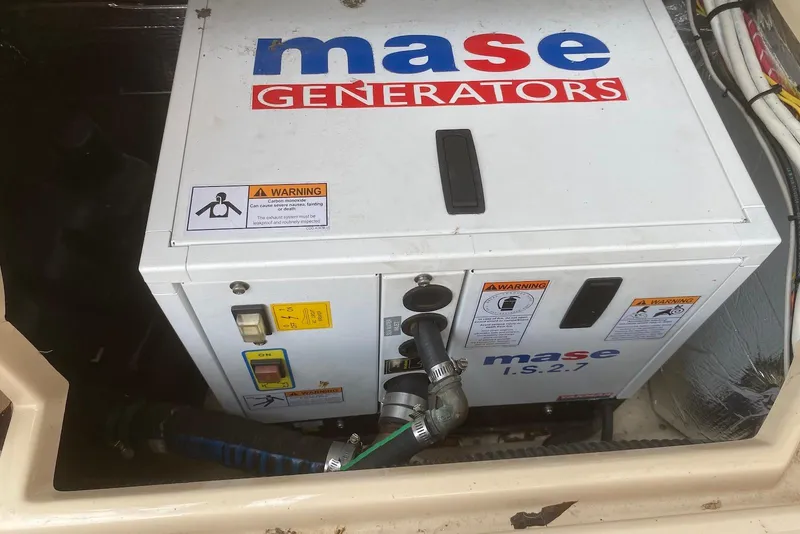Slide: The Image of Mase generator in a 2013 Cutwater 28 boat engine compartment. - 32