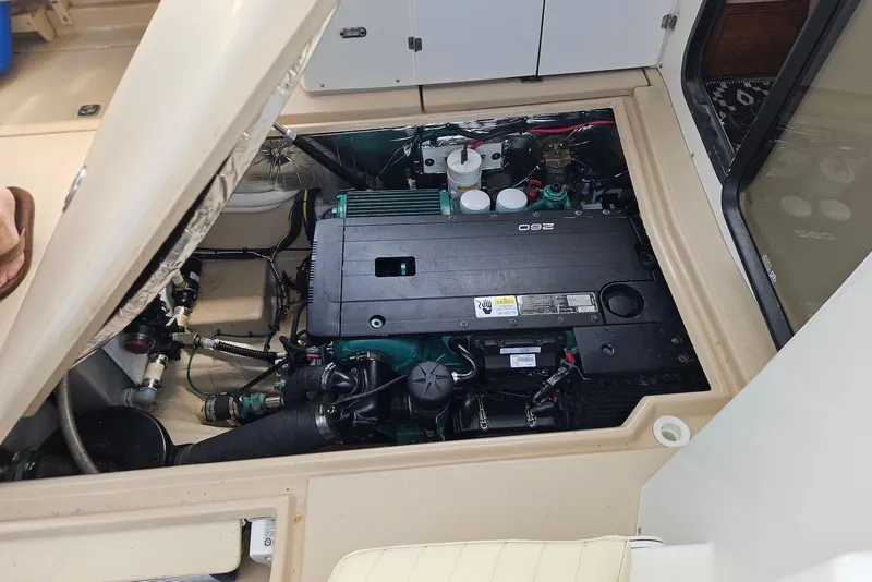 Slide: The Image of Engine compartment of a 2013 Cutwater 28 boat, showcasing detailed mechanical components. - 33